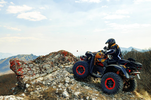 a man riding an ATV.