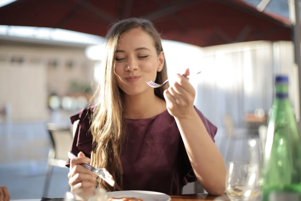 a woman enjoying her food in Broken Bow, Oklahoma.