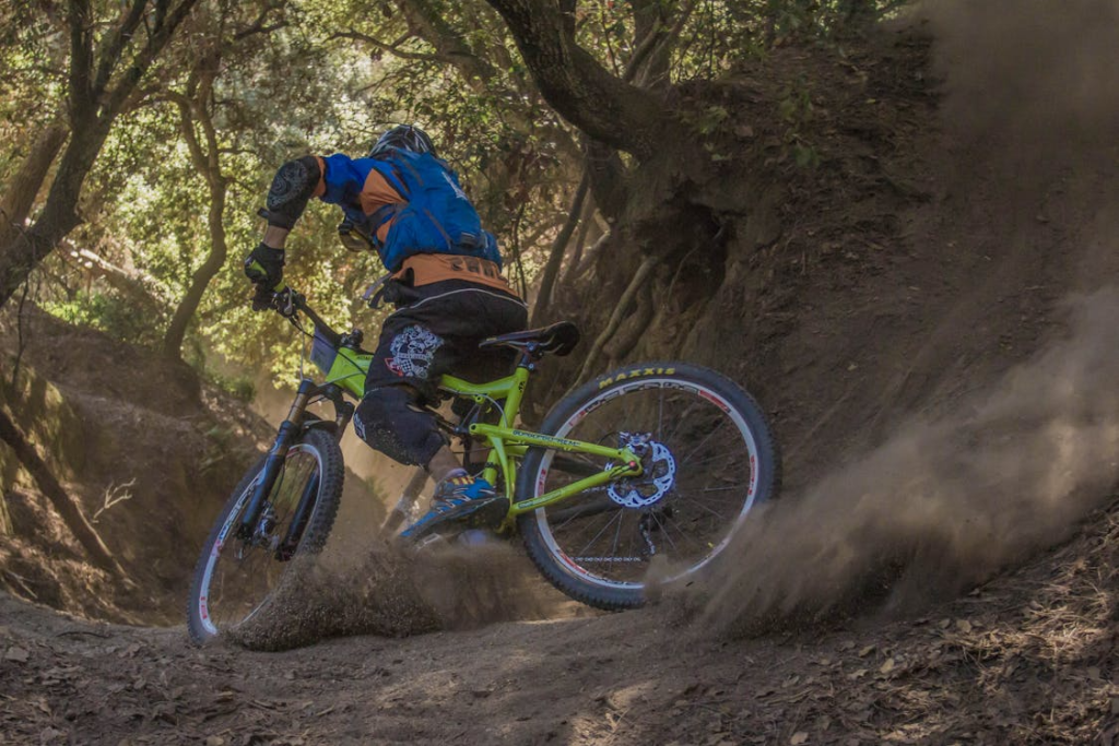 a man mountain biking.