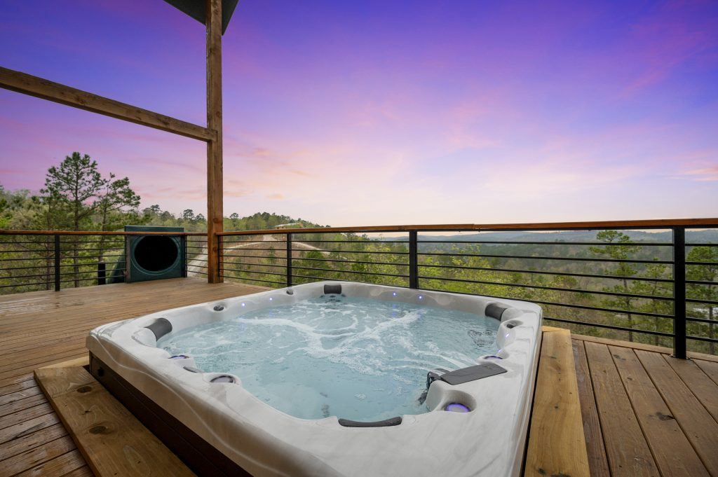 An image of a hot tub on a cabin deck in Broken Bow