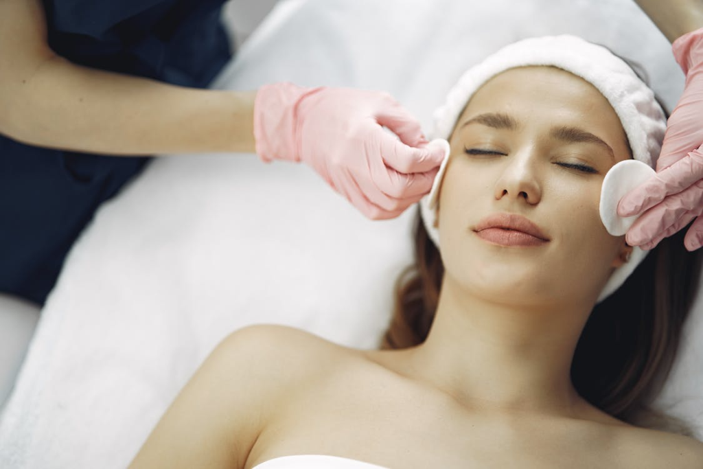 An image of a woman getting a facial treatment