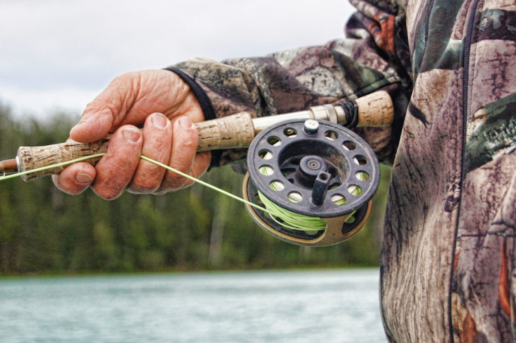 a person holding a fishing rod.