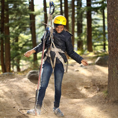 a woman in a yellow safety helmet.